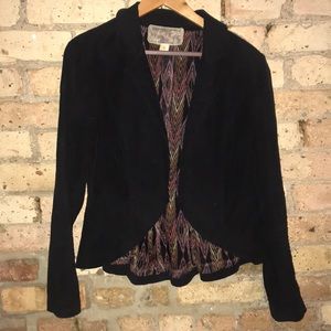 Black velour buttonless jacket.